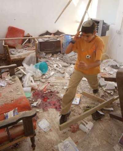 israeli_boy_in_bombed_house-1.jpg