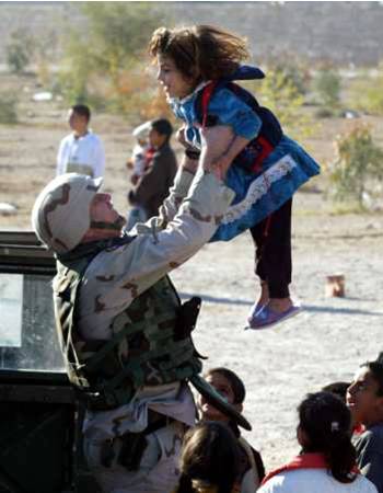 soldier throws child into air 3 - On a lighter note ... (American soldiers)